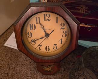 Small wall clock with brass eagle