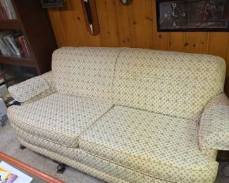 Vintage clawfoot sofa - has heavy yellowing of the fabric