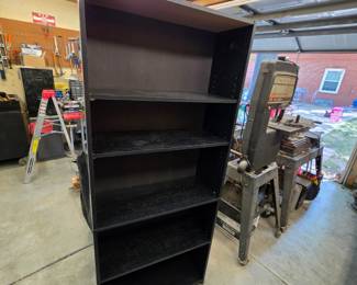 Laminate Bookcase- has some water damage at bottom- pick up last day or after sale only