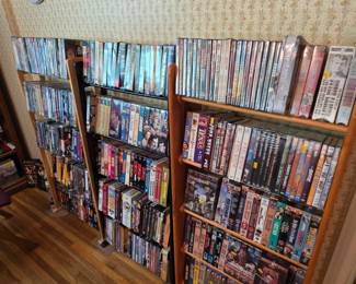 VHS and DVDs - many new in wrapper. Lots of John Wayne