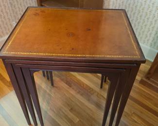 Vintage besting tables in nested position. Fully nested with grooves to slide tables in.