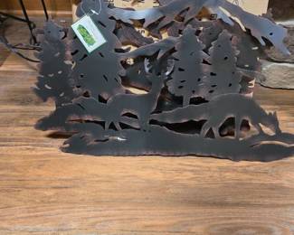 Rustic Metal Deer & Wildlife Silhouette Décor Layered metal wildlife silhouette featuring deer, evergreen trees, fish and a woodland scene. Rustic dark finish with dimensional design. Great cabin, lodge or outdoor-themed décor. Original hang tag attached. Pre-owned condition; see photos for details.