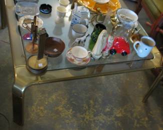 brass coffee table and knickknacks