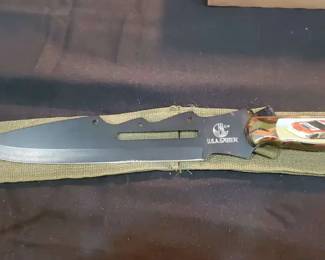Saber fixedblade Bowiestyle knife with a custom NASCARthemed handle featuring Dale Earnhardt