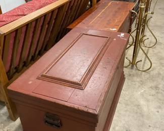 Antique original red stain large trunk, nice, clean cedar chest next to it..