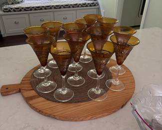 Signed Romeo Glass by Minh Martin Set of 13 beautiful amber stemmed glasses, handblown and signed by artist Minh Martin of Romeo Glass. Rich amber color with unique artisan character.