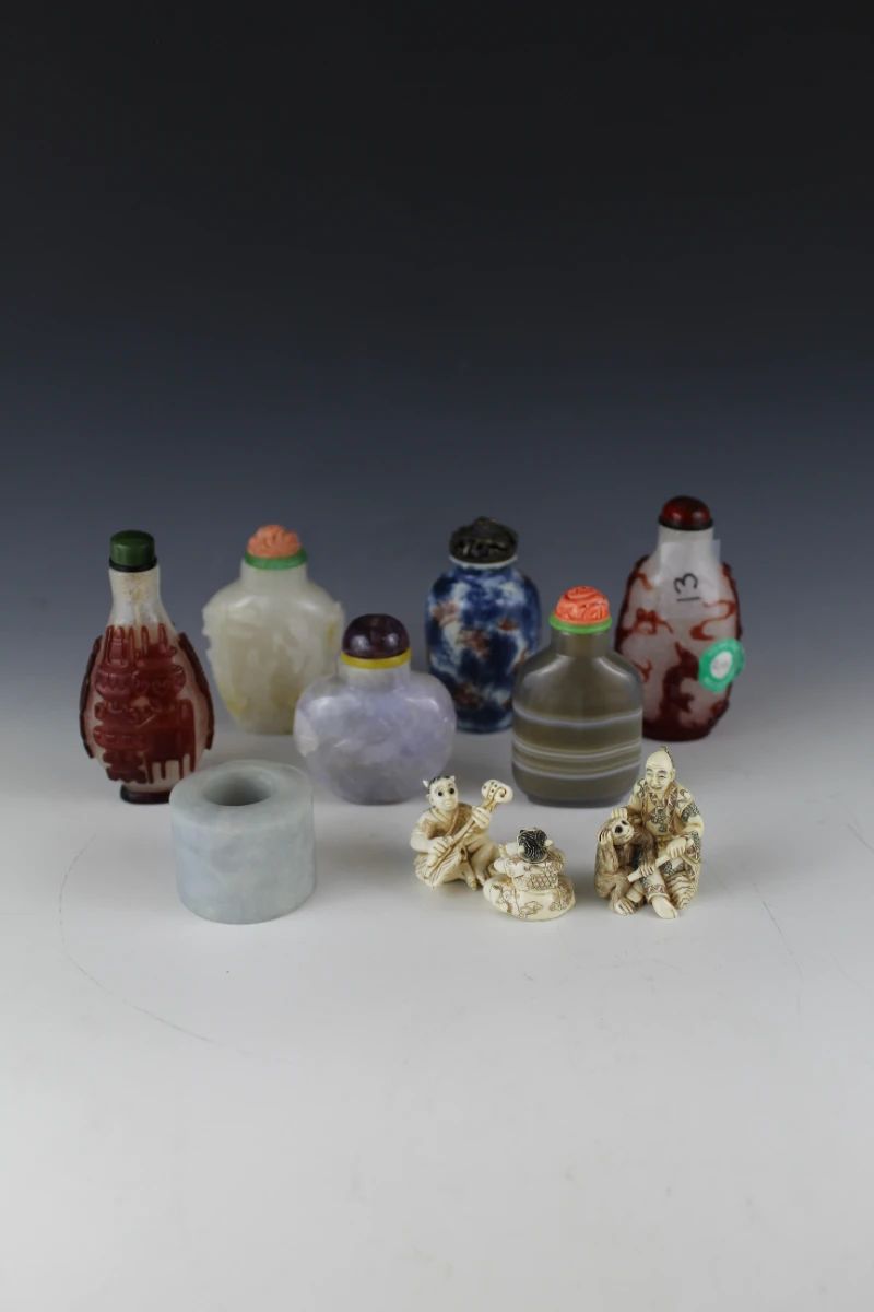 Huge selection of Chinese snuff bottles, Chinese Archer Rings/Thumb Rings and other small Asian art items.