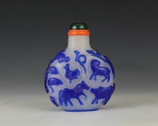Snowflake glass with blue overlay featuring Chinese zodiac animals.