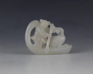 Small Asian Carved Scholar's Object featuring a boy steering a sampan in the shape of a swan. A playful duck tugs on his sleeve.