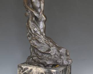 Bronze casting of The Waltz by Auguste Rodin on a black and white marble base.