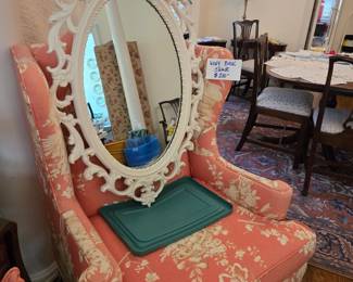 Oval wall mirror,  wingback chair