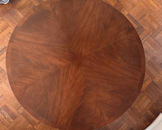 Mahogany Dining / Entry Table with Starburst Inlay with Brass Claw Caps & Casters Attributed to Burton Ching. Measures 50" D x 29" H with 26" Clearance. Photo 2 of 4.  