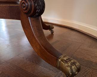 Mahogany Dining / Entry Table with Starburst Inlay with Brass Claw Caps & Casters Attributed to Burton Ching. Measures 50" D x 29" H with 26" Clearance. Photo 4 of 4.  