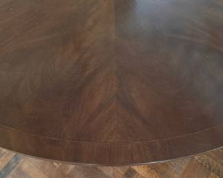 Mahogany Dining / Entry Table with Starburst Inlay with Brass Claw Caps & Casters Attributed to Burton Ching. Measures 50" D x 29" H with 26" Clearance. Photo 3 of 4.  