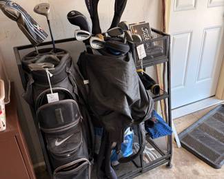 Suncast Golf Club Organizer with Nike and Stand Golf Bags and Assorted Clubs