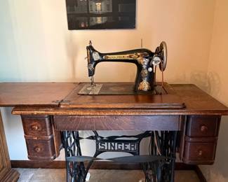 Singer Model 66 "Red Eye" Treadle Sewing Machine in Oak Cabinet