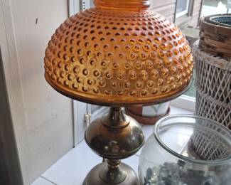 Amber hobnail hurricane style lamp with brass base
