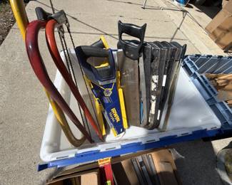 Various Saws with a selection of individual replacement blades