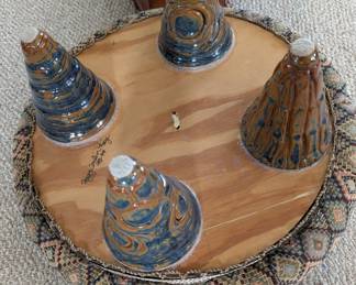 Underside of footstool. Ceramic legs. Made by Peggy Conlin Fay.