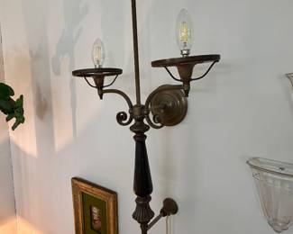 Vintage French Empire style brass and leather wall sconce.