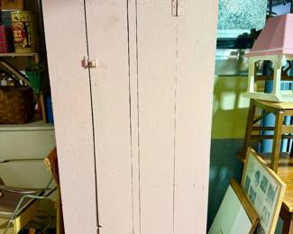 Primitive pink cabinet.