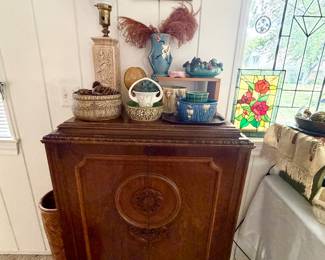 Beautiful vintage radio cabinet filled with electronics.