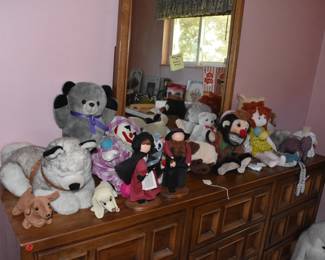 dolls, stuffed animals, wood dresser with mirror