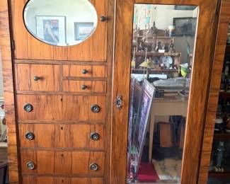 Victorian-style burl walnut wardrobe/armoire: Large wardrobe with an oval beveled mirror (upper left door) and full-length beveled mirror (right door), graduated drawers with turned pulls and working keyhole escutcheons; likely late 19th-early 20th c.