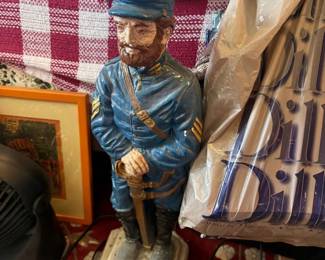 Chalkware Civil War Union soldier lamp: Large painted chalkware/plaster figural lamp of a Union Army sergeant (blue uniform, chevron stripes, sword, cap) on a faux-stone octagonal pedestal base with cord; no shade present.