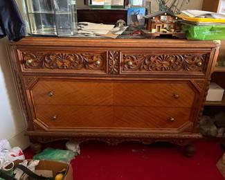 Victorian/Edwardian oak dresser (c. 1900-1920s), heavily carved floral drawer fronts, figured tiger-oak veneer lower drawers, turned posts, ball feet.