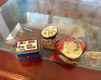 'Jouets Limoges' train-themed box: Rectangular blue-rimmed box hand-painted with toy trains and track, French text reading 'JOUETS LIMOGES / 3 WAGONS / 1 GARE' ('toys / 3 wagons / 1 station').