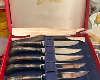 Burdines boxed steak knife set, 6 pieces:  Six steak knives with silver-plated handles (tarnished), serrated stainless blades, in original red Burdines department store gift box