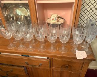 Waterford Marquis crystal stemware:  Large lot (20+ pieces) of Waterford Marquis cut-crystal stemware in vertical panel pattern: water goblets, iced tea glasses, wine glasses, and champagne flutes