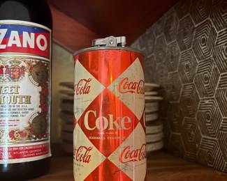 Vintage Coca-Cola 'Diamond' Can Table Lighter:  Coca-Cola advertising table lighter in the form of a red/white diamond-pattern 'Coke' can, 12 fl oz design, with lighter mechanism mounted on top.