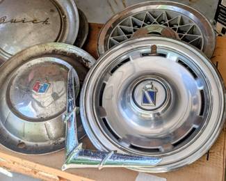 Early vintage hubcaps & hood ornament