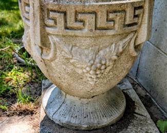 Many old vintage concrete planters in the yard!