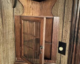 #51 corner wall hang shelf with 1 glass door 12x31 t $75.00
