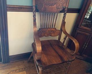 #25 arm oak carved back chair $35.00