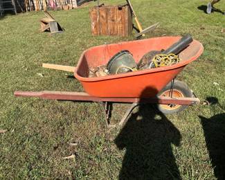 #234 red plastic wheel barrow $30.00