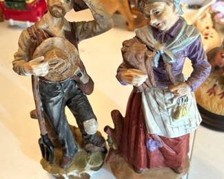 #128 pair of man lady statues 12 tall $20.00