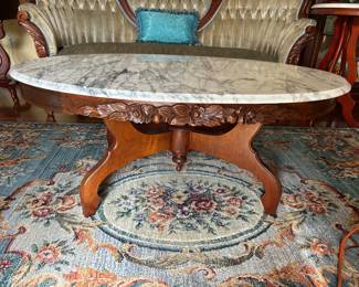#13 marble top oval rose wood coffee table on 4 legs 45x28x18 $100.00