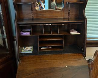 #26 wood secretory with drop front shelves and cubbies 32x12-26x61 $100.00