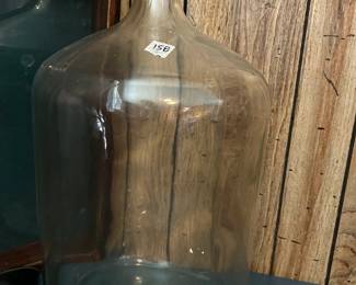 #158 glass wine jug with cork 21 in tall $40.00
