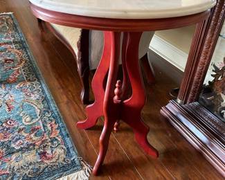 #17 oval marble top end table with wood bottom 25x18x29 $75.00