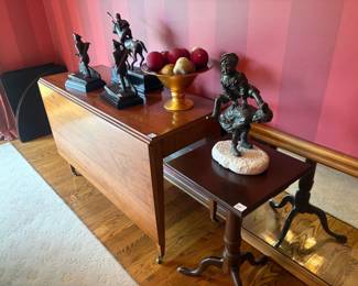 . . . awesome drop-leaf antique table -- and sculptures