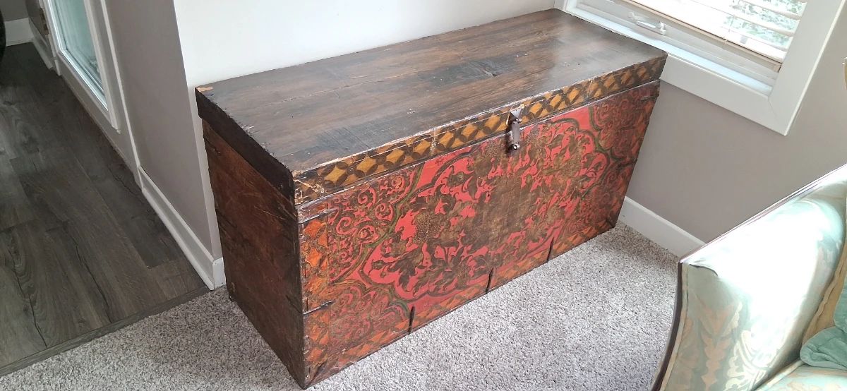 hand-painted wooden storage chest, likely of Himalayan or Tibetan
