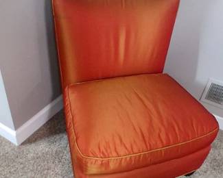 vibrant orange armless slipper chair