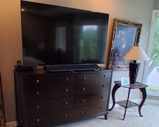 dark brown wooden dresser with six or eight drawer