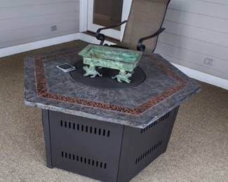 The item in the image appears to be a Hiland Faux Stone Hexagon Fire Pit  $300