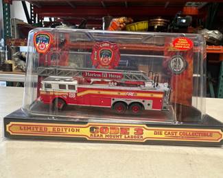 Lot 218: Code 3 FDNY Ladder 28 Harlem Hilton Seagrave 1:64 Diecast